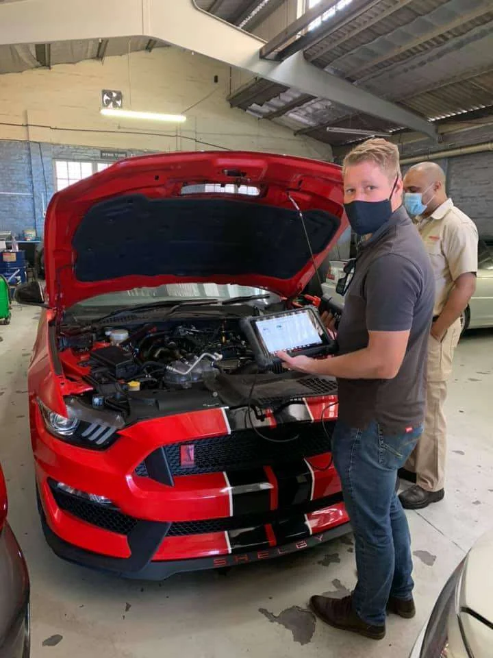Autel diagnostic platform connected to a Shelby Mustang in the workshop